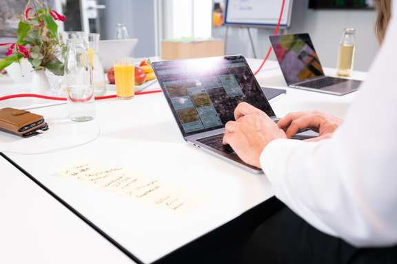 Close up of typing hands on laptop