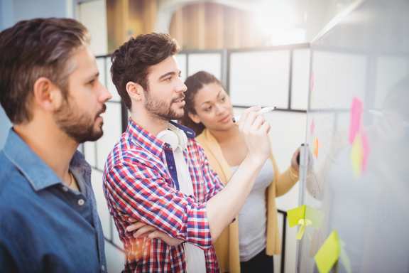 Team working on a whiteboard