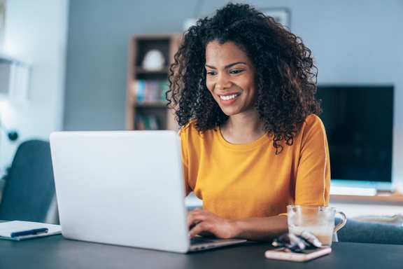 Woman sitting at laptop